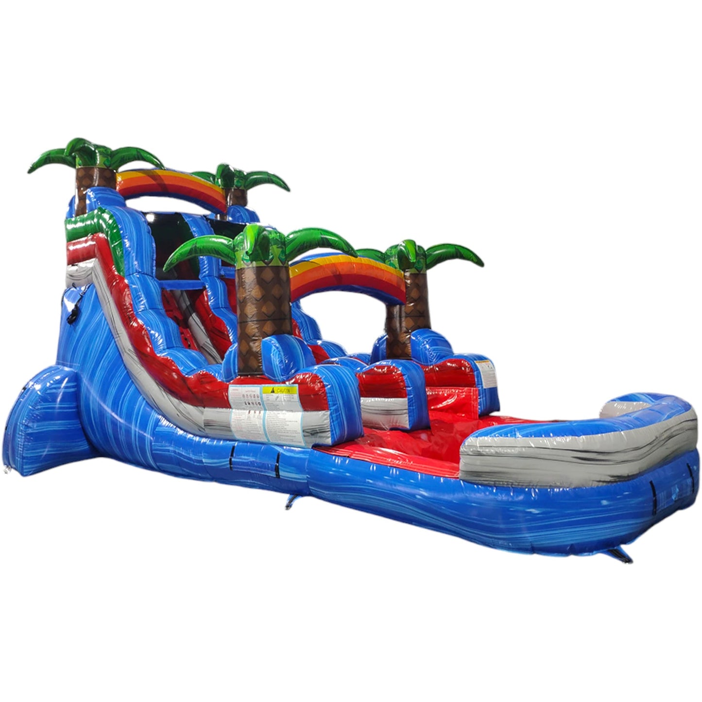 Large tropical-themed inflatable water slide featuring a single blue sliding lane, palm tree decorations, and an extended splash pool with vibrant blue and red colors in indoor warehouse setting.