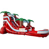 Large tropical-themed inflatable water slide featuring a single red sliding lane, palm tree decorations, and an extended splash pool with blue wave-like design.