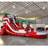 Large tropical-themed inflatable water slide featuring a single red sliding lane, palm tree decorations, and an extended splash pool with blue wave-like design.