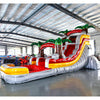 15ft Fire Island Commercial Single Lane Inflatable Water Slide angled view highlighting red slide, yellow inflatable pool, palm trees, and tropical theme in a warehouse environment
