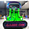 Front view of Game Wave inflatable water slide displaying vibrant green design, single lane, VR headset decoration on top, and spacious splash pool with "Game On" sign in indoor facility.