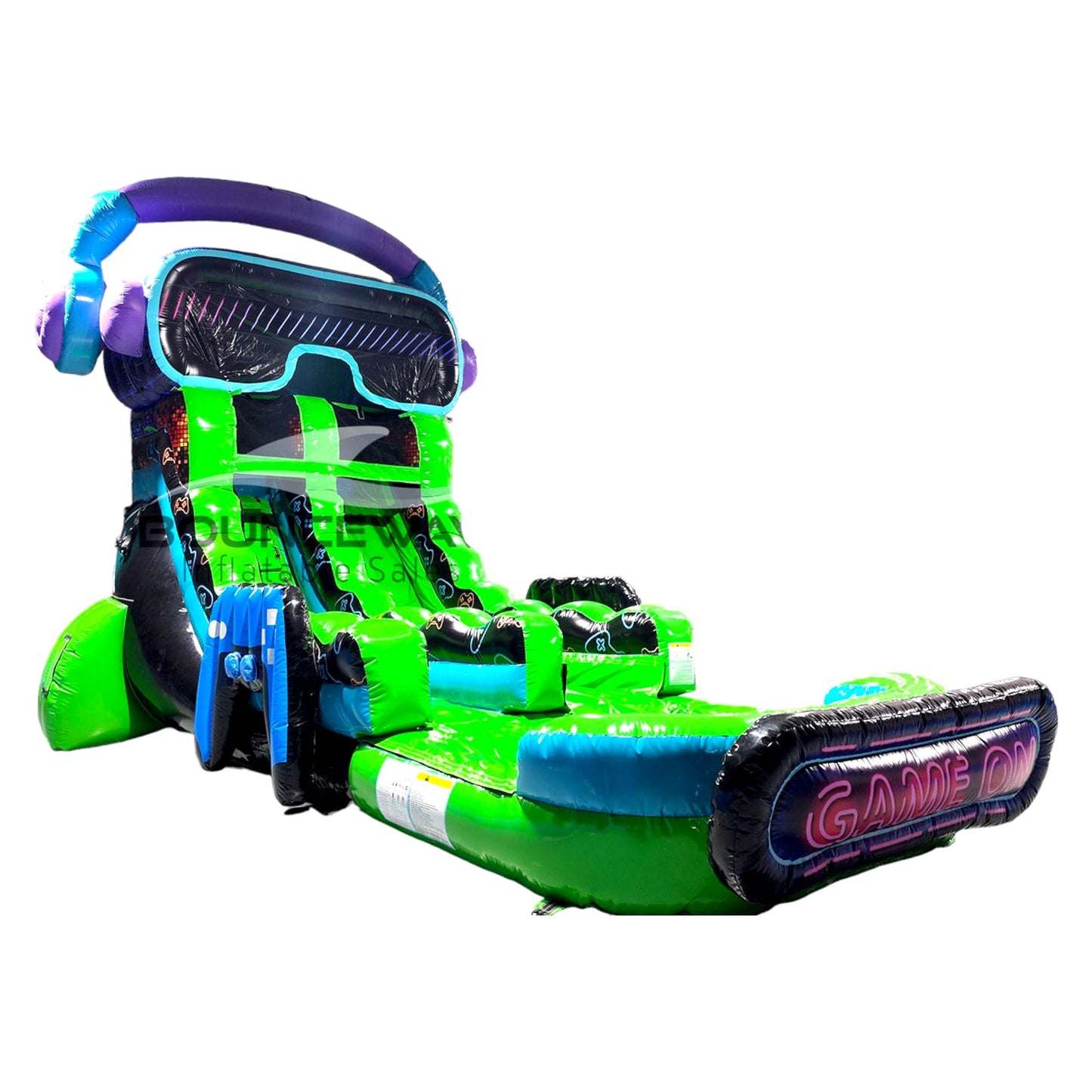 Side view of Game Wave single lane water slide showing full length with green sliding surface, VR headset-shaped top, and large splash area with gaming-inspired decorations.