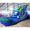 Side view of Island Drop inflatable water slide displaying full length with blue sliding lane, palm tree accents, and spacious splash pool in indoor facility.