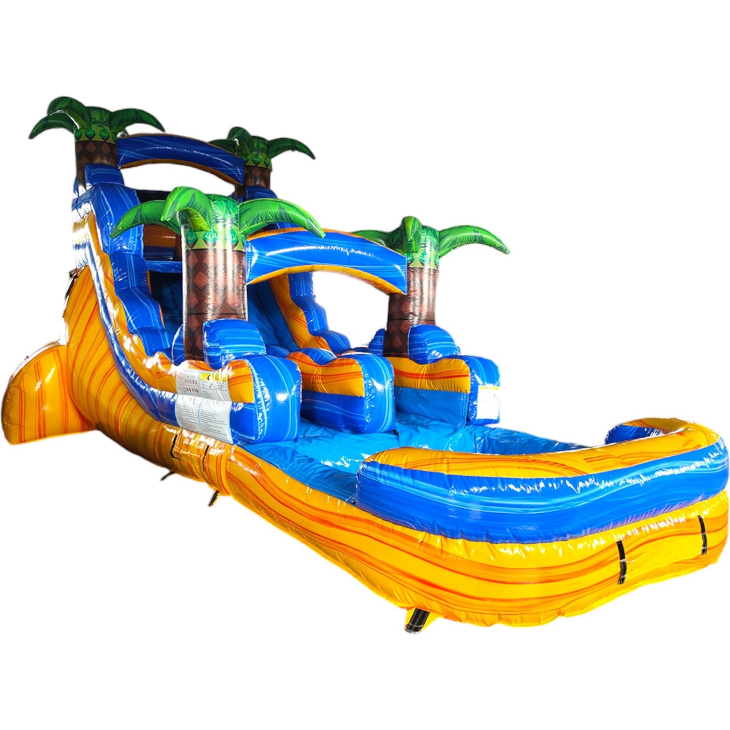 Large tropical-themed inflatable water slide featuring a single blue sliding lane, palm tree decorations, and an extended splash pool with vibrant yellow and blue colors.