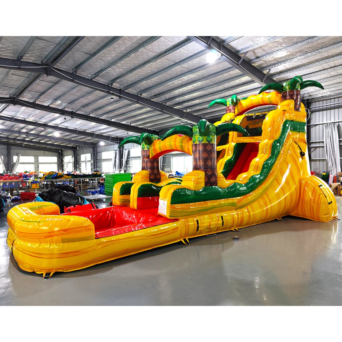 15ft Rasta Splash Commercial Single Lane Inflatable Water Slide side angle displaying yellow frame, red curved slide, palm tree decorations, and large inflatable pool area
