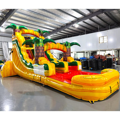 15ft Rasta Splash Commercial Single Lane Inflatable Water Slide side view highlighting yellow structure, red slide, green palm trees, and red splash pool in indoor facility
