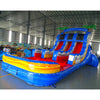 15ft Rip Curl Dual Lane Center Climb Inflatable Water Slide angled view highlighting blue structure, red slides, palm tree accents, and vibrant pool area in indoor facility
