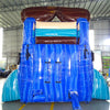 Rear view of South Beach inflatable water slide showing tall blue structure with climbing area and brown sunglasses-shaped top in indoor warehouse setting.