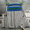 Rear view of 18ft Aloha Splash Center Climb water slide showing white support structure, blue and green top section with palm tree decorations, and safety netting for the climbing area.