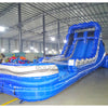 Side view of the 18-foot Blue Lagoon inflatable waterslide, showcasing its height, dual sliding lanes, vibrant blue color scheme, and extended splash area with white accents