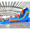 Side angle view of the 18-foot Deep Sea Dive hybrid inflatable water slide in an indoor setting, displaying its impressive size, dual sliding lanes, underwater theme with sea creature decorations, and extended splash pool area.