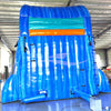 Rear view of the 18-foot Deep Sea Dive hybrid inflatable waterslide, highlighting its tall blue structure, safety features, and vibrant ocean-inspired graphics. The image shows the climb-up area and the top of the slide.