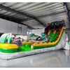 Side view of dinosaur-themed inflatable water slide in indoor setting, showing height and prehistoric design.