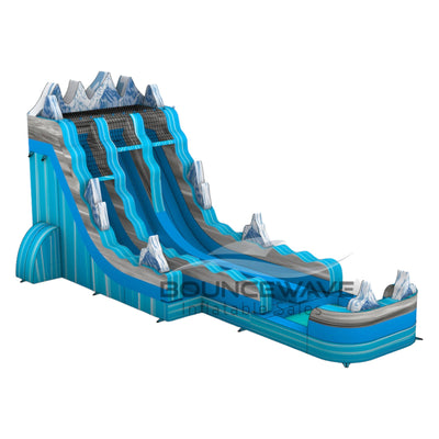 Side view of Glacier Bay inflatable water slide displaying its length, dual blue lanes, and mountain-inspired design with snowy peak decorations.