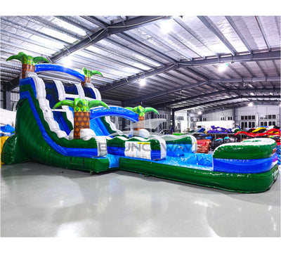 Side view of Green Gush hybrid water slide featuring dual lanes, palm trees, and extended splash pool with tropical design.