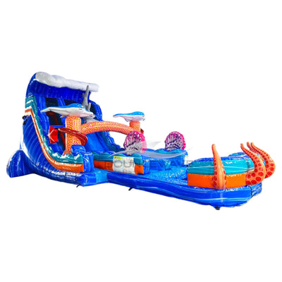 Large ocean-themed inflatable water slide with blue base, featuring shark decorations, dual lanes, and extended splash pool with octopus tentacles.