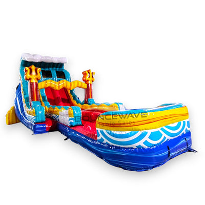 Large ocean-themed inflatable water slide with trident decorations, featuring dual lanes, blue and yellow colors, and an extended splash pool with wave design.