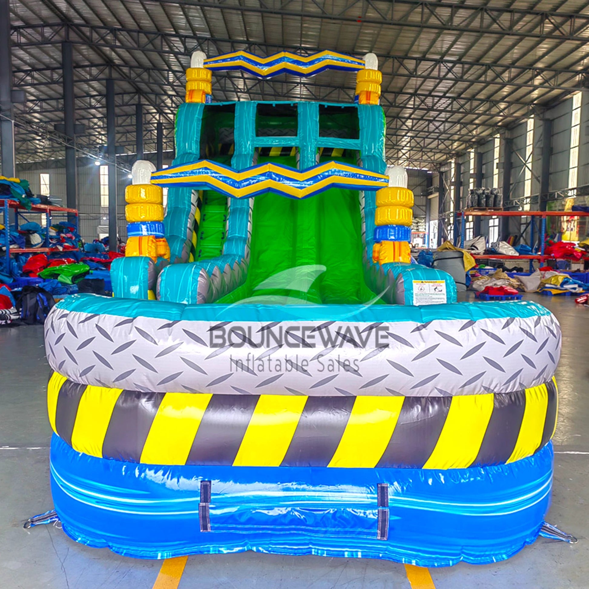 Front view of Radioactive Run inflatable water slide displaying vibrant green slides, blue supports, and large splash area with caution stripe design.