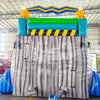 Rear view of Radioactive Run hybrid water slide in indoor warehouse, showing tall structure with climbing area and safety features.