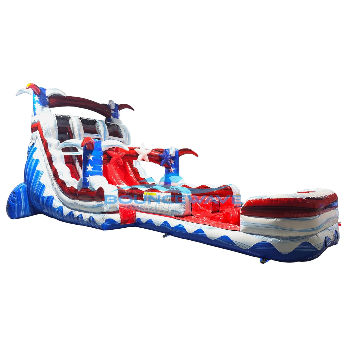 Large patriotic-themed inflatable water slide featuring American flag colors, dual sliding lanes, star decorations, and an extended splash pool with red, white, and blue wave patterns.