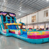 Side view of 20ft Island Flow Hybrid DL water slide showing vibrant turquoise colors, inflatable palm trees, and a large splash pool area with tropical designs. The slide features a giant sunglasses decoration on top and is displayed in an indoor facility with other inflatables visible.