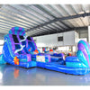 Front view of the 20ft Mermaid's Cove Hybrid DL inflatable water slide, showcasing its blue and purple sliding lanes, shell-shaped top, mermaid decorations, and spacious splash pool. The slide is set up in an indoor warehouse with other inflatables and equipment visible.