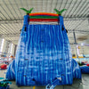 24ft Baja Splash DL 2pc Commercial Water Slide with Inflatable Slip & Slide featuring tropical palm trees, blue slide, and extended slip and slide in spacious warehouse