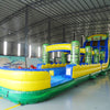 24ft Tiki Typhoon Dual Lane 2pc Commercial Water Slide with Inflatable Slip & Slide featuring tropical theme, tiki statues, and dual blue slides in warehouse setting
