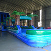 24ft Trop Wave DL 2pc Commercial Water Slide with Inflatable Slip & Slide front view highlighting vibrant colors, palm tree decorations, and extended blue water slide
