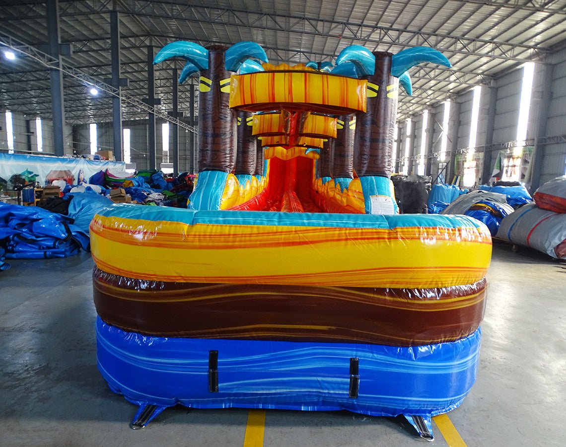 24ft Tropic Shock Dual Lane Commercial Water Slide with Inflatable Slip & Slide front view displaying colorful tropical theme, dual slides, and expansive inflatable pool area
