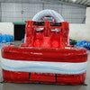 Front-angle view of 46ft Crimson Bay Commercial Hybrid Inflatable Obstacle Course showing its full length. The structure features a red base with blue accents, multiple climbing walls, slides, and various obstacles. Set up in a warehouse with metal roofing and bright lighting, showcasing its scale and commercial application.