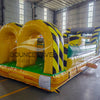 46ft Toxic Open Air Hybrid Inflatable Obstacle Course featuring yellow and black hazard stripes, multiple arches, and green base in warehouse setting
