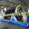 Wide-angle view of 53ft XL Radioactive Run Commercial Hybrid Inflatable Obstacle Course set up in a large indoor warehouse. The inflatable features yellow and black hazard stripes, multiple arches, tunnels, and obstacles. Metal roofing, support beams, and various other inflatable products are visible in the background, showcasing its size and commercial setting.