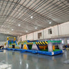 92ft Radioactive Run 3-Piece Wet/Dry Inflatable Obstacle Course side view showcasing long yellow structure with black caution stripes, various challenges, and inflatable pool area
