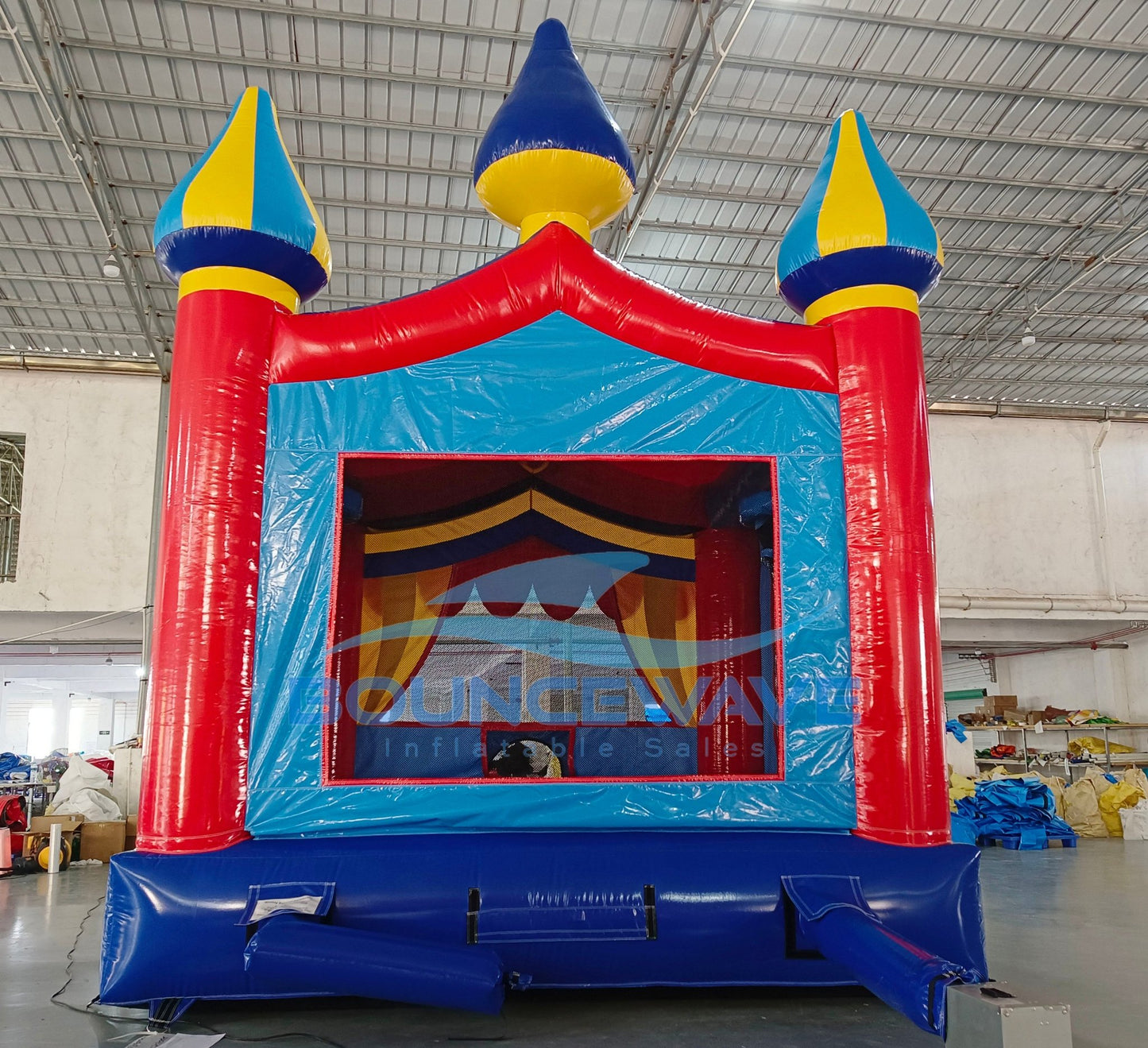 Carnival Commercial Grade Bounce House interior view displaying bright colors, mesh safety barriers, and Bounceway branding
