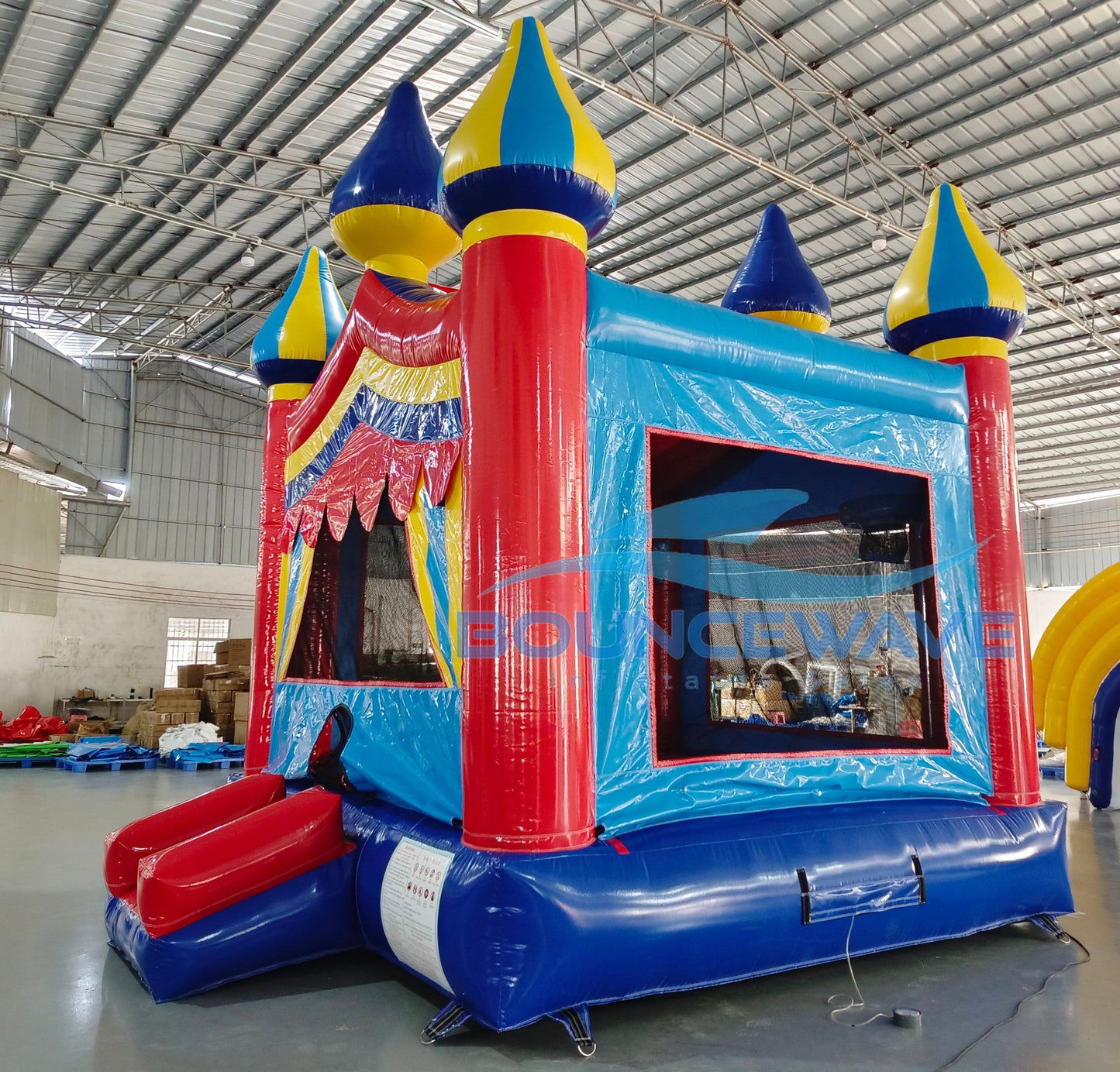 Carnival Commercial Grade Bounce House interior view showcasing colorful castle design with mesh windows, safety entrance, and Bounceway branding