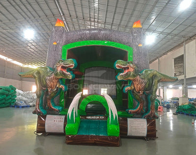 Dino Dive Commercial Grade Bounce House showcasing dual T-Rex figures, grey castle structure, and flame-topped turrets in indoor facility
