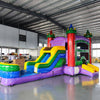 Wide-angle view of the Euro Marble Econo Combo in an indoor warehouse. Highlights the colorful castle-themed inflatable with bounce house, slide, and splash pool. Other inflatable products and warehouse equipment visible in the background.