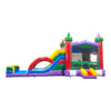 Large colorful inflatable castle-themed combo featuring dual curved slides in red and blue. The structure has vibrant purple, yellow, green, and red colors with castle turrets and flags. Includes a spacious bounce house area with mesh windows and a splash pool at the base. Set against a white background, showcasing its multi-functional wet/dry design.