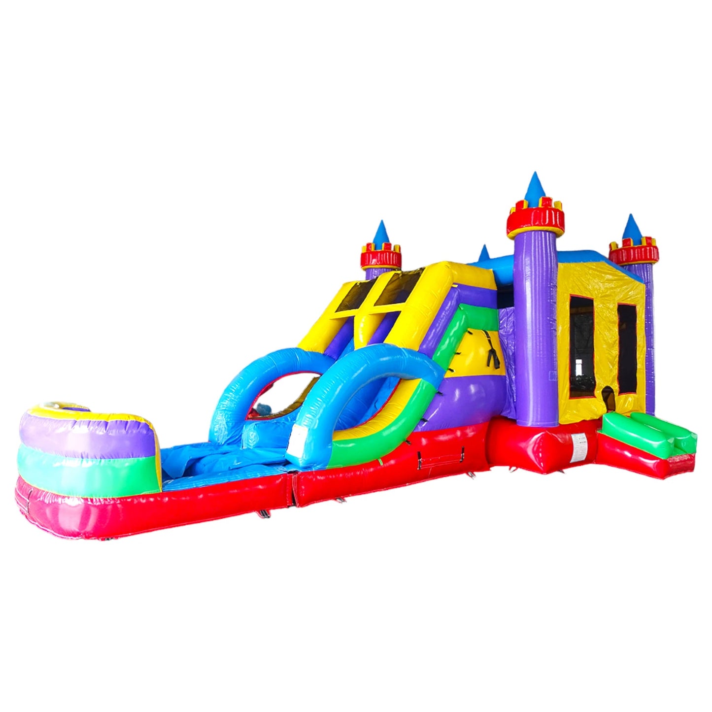 Side view of Flat Euro Dual Lane Commercial Inflatable Combo showcasing its full length. The inflatable features purple castle towers with yellow flags, dual blue slides, and a large circular splash pool. The bounce house area has mesh windows for visibility. Set against a white background, highlighting its design for commercial wet/dry use.