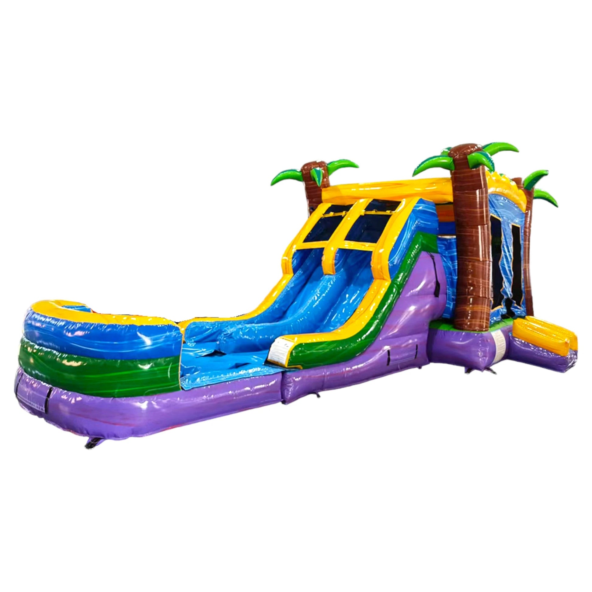 Large tropical-themed inflatable combo featuring dual curved blue slides, palm tree pillars, and a vibrant yellow and blue structure. The combo includes a bounce house area with mesh windows, a splash pool, and a colorful "Goombay Splash" banner. Set against a white background, showcasing its design for commercial wet/dry use.