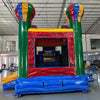 Front view of Marble Balloon Econo Combo, showcasing the bounce house entrance with colorful hot air balloon decorations, slide, and splash pool area. Set up in an indoor facility with other inflatable products and equipment visible in the background.