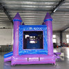 Close-up front view of Mystic Castle Commercial Econo Inflatable Combo (Wet/Dry) highlighting the entrance with purple turrets, blue walls, and yellow accents. Mesh windows and interior obstacles visible. Displayed in an indoor warehouse setting, emphasizing its detailed design and commercial-grade construction.