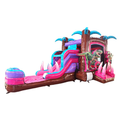 Side view of Pink Dino Econo Combo showing bright pink, purple, and blue design with inflatable palm trees, curved slide, and large splash pool area. The combo includes realistic dinosaur figures and is displayed against a white background.