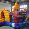 Colorful inflatable Primary Marble Toddler Bounce House featuring a central yellow dome with orange swirl patterns. Four corner towers in blue, green, red, and yellow with conical tops. Blue base with mesh windows and a small entrance slide. Set up in an indoor warehouse with metal roofing and windows visible.