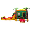 Wide-angle view of Rasta Splash Dual Lane Commercial Inflatable Combo isolated on a white background. The inflatable features dual slides in red and yellow, inflatable palm trees, a green bounce house structure, and a colorful base in yellow, green, and red. The design showcases its tropical theme for commercial wet/dry use.