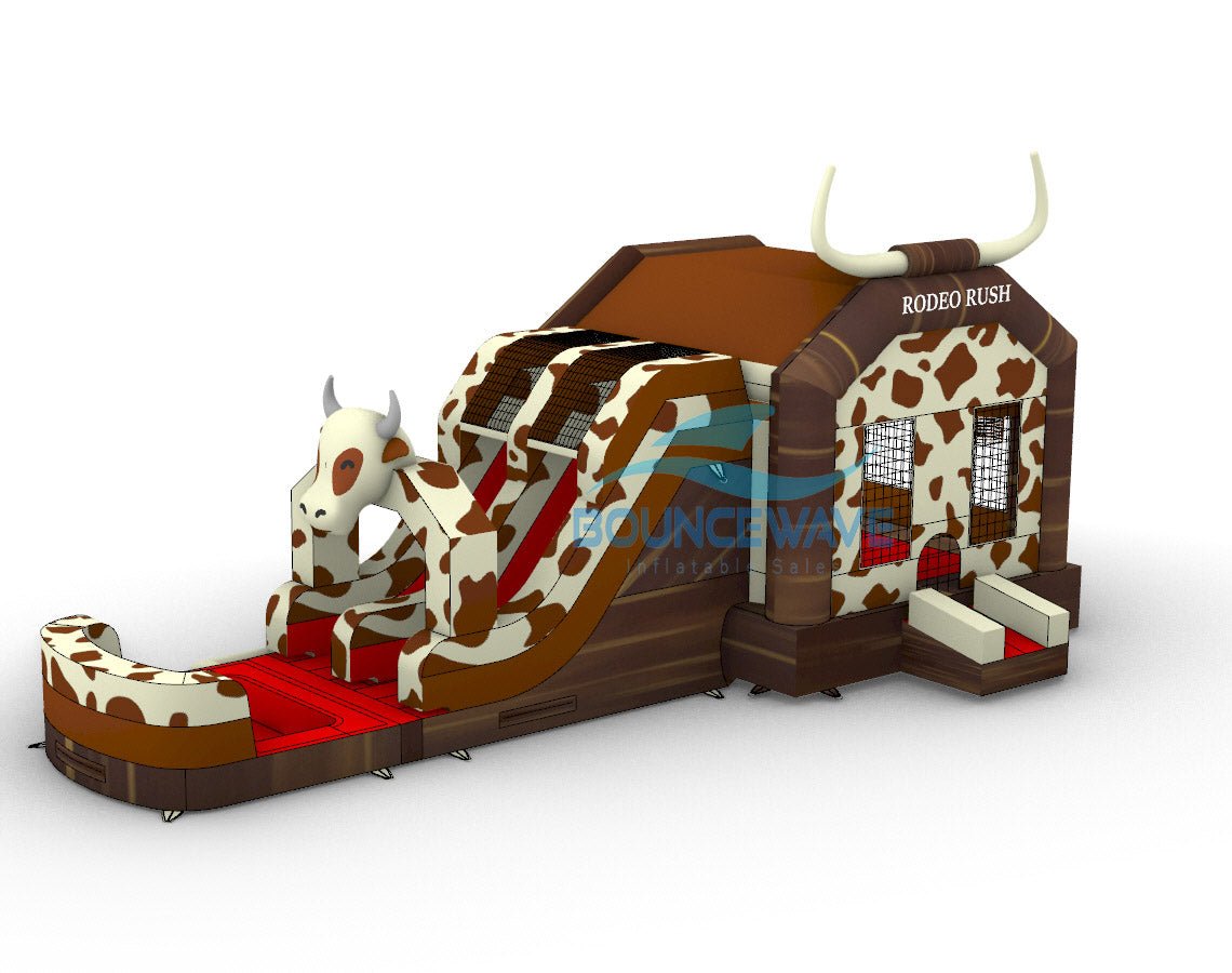 Three-quarter view of Rodeo Rush Dual Lane Commercial Inflatable Combo against a white background. The structure displays a brown base with cow print patterns, a bull-shaped figure with dual slides, and a bounce house area with mesh windows. Large white horns top the inflatable, and "RODEO RUSH" is clearly visible. The image showcases the combo's western theme and detailed design for commercial use.