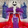 Close-up view of Spooky Splash Halloween Dual Lane Commercial Inflatable Combo showing the entrance area. Features blue castle towers, dual red slides, and a large inflatable ghost figure perched on top. The bounce house area has red entrances and purple walls. Set in a warehouse with metal roofing and bright overhead lighting.