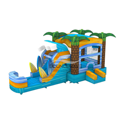 Three-quarter view of Surf's Up Commercial Econo Inflatable Combo (Wet/Dry) showcasing the wave-shaped slide, bounce house with palm tree decorations, and surfboard designs. Features a blue base, yellow accents, and green palm trees. Mesh windows and entrance visible. Displayed on a white background, emphasizing its tropical beach theme.